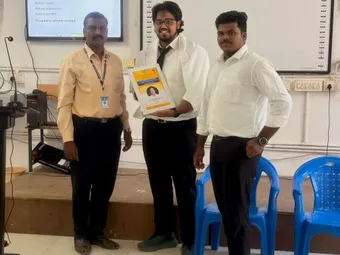 Pramodh receives a memento from the Department of Tourism & Hotel Management