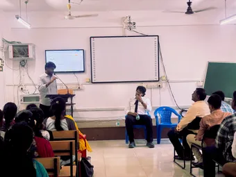 A student asks a question during the Q&A